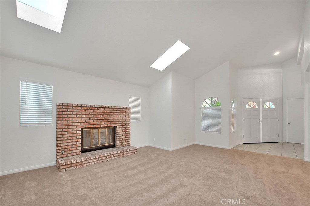 2015 Morgan Lane, Unit B Redondo Beach, CA 90278 - Photo 6 of 19 a view of empty room with a fireplace and window