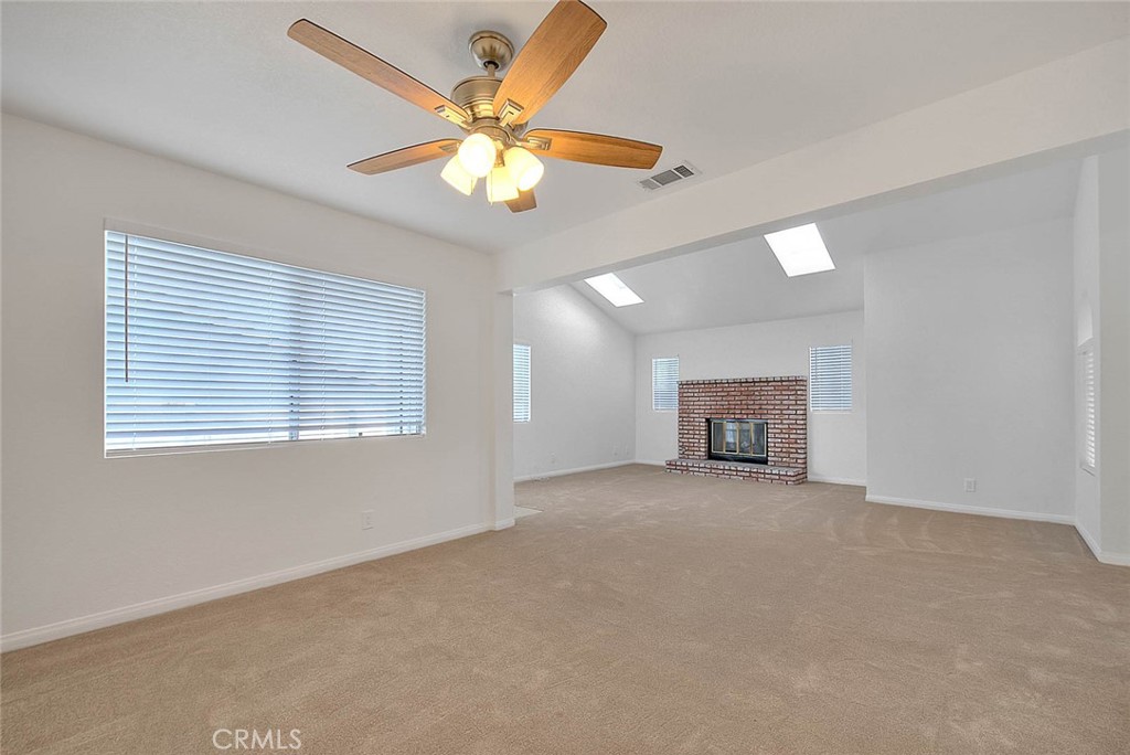 2015 Morgan Lane, Unit B Redondo Beach, CA 90278 - Photo 7 of 19 an empty room with windows and chandelier fan