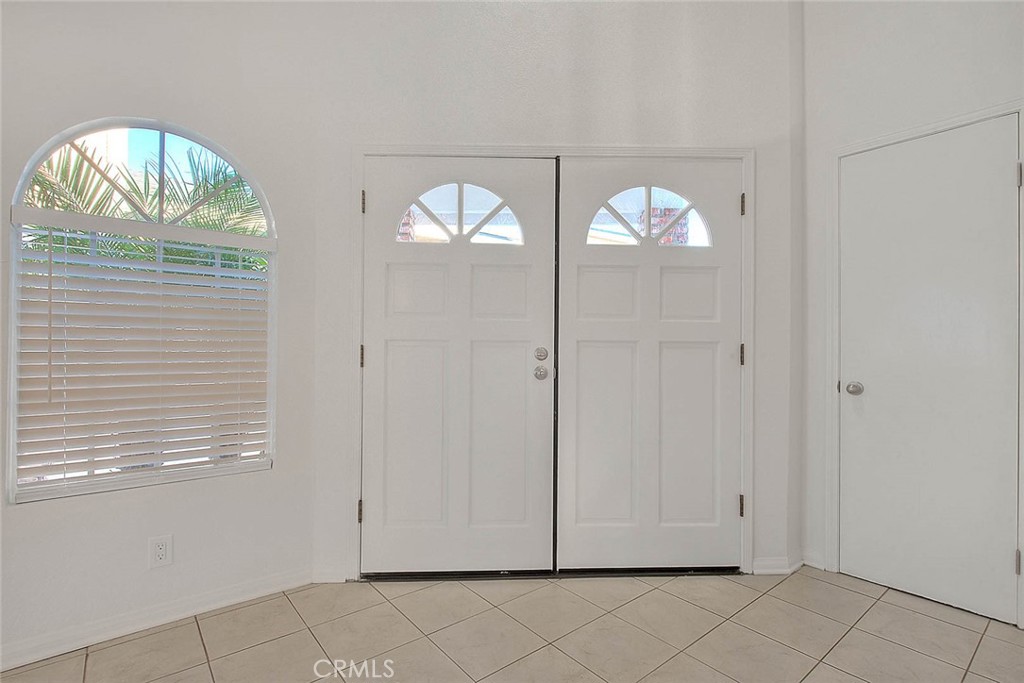 2015 Morgan Lane, Unit B Redondo Beach, CA 90278 - Photo 9 of 19 an empty room with wooden floor fan and windows