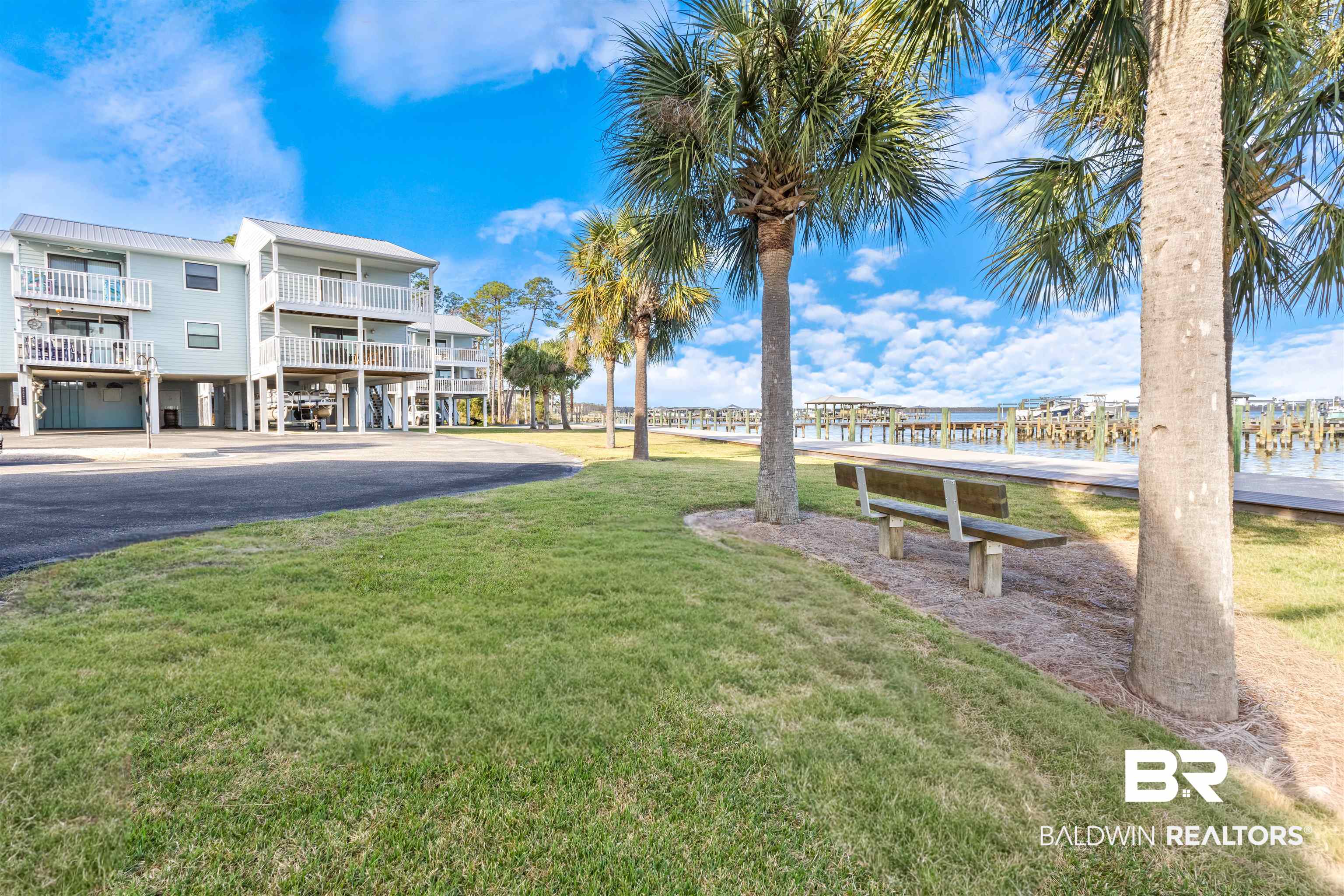 25861 Canal Road, Unit 3 Orange Beach, AL 36561 - Photo 25 of 40 Surrounding community featuring a lawn