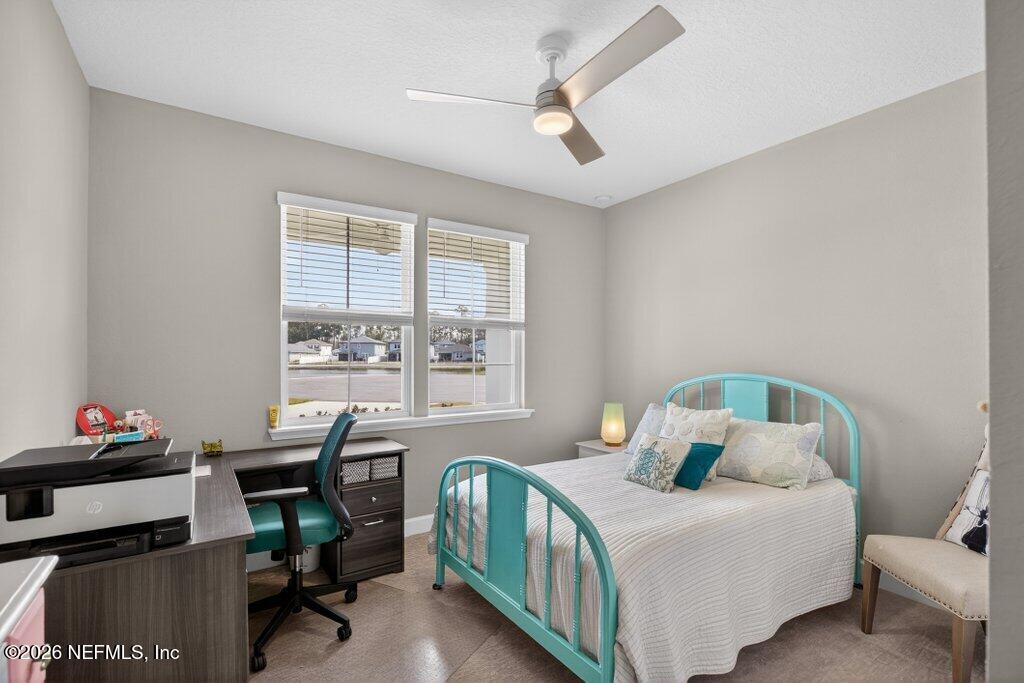 12 Wards Ravine Way St. Johns, FL 32259 - Photo 13 of 73 a bedroom with a bed a desk and chair