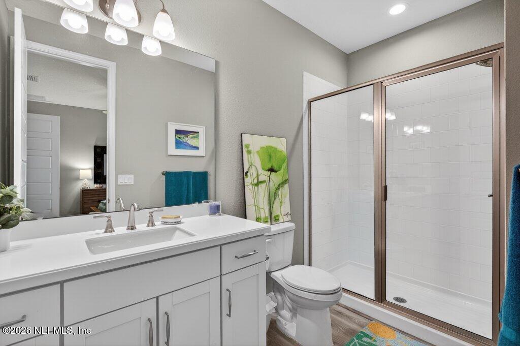 12 Wards Ravine Way St. Johns, FL 32259 - Photo 24 of 73 a bathroom with a double vanity sink toilet and shower