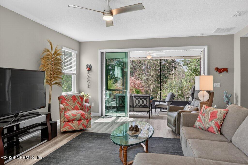 12 Wards Ravine Way St. Johns, FL 32259 - Photo 38 of 73 a living room with furniture a flat screen tv and a large window