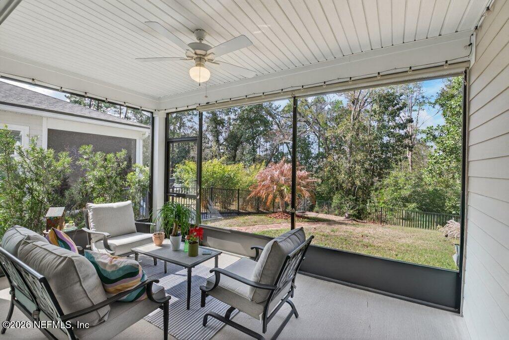 12 Wards Ravine Way St. Johns, FL 32259 - Photo 52 of 73 a living room with furniture and a floor to ceiling window