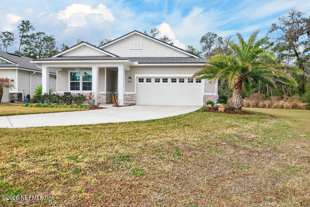 12 Wards Ravine Way St. Johns, FL 32259 - Photo 8 of 73 a front view of a house with a garden and plants