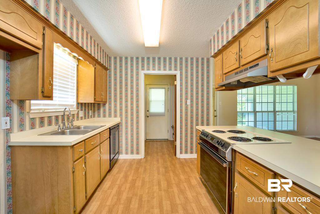 9385 Prairie Drive Semmes, AL 36575 - Photo 4 of 19 Kitchen is open to the family room