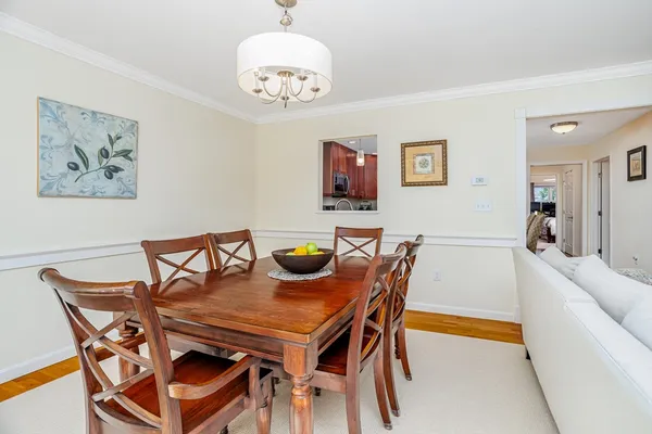 a view of a dining room and livingroom with furniture