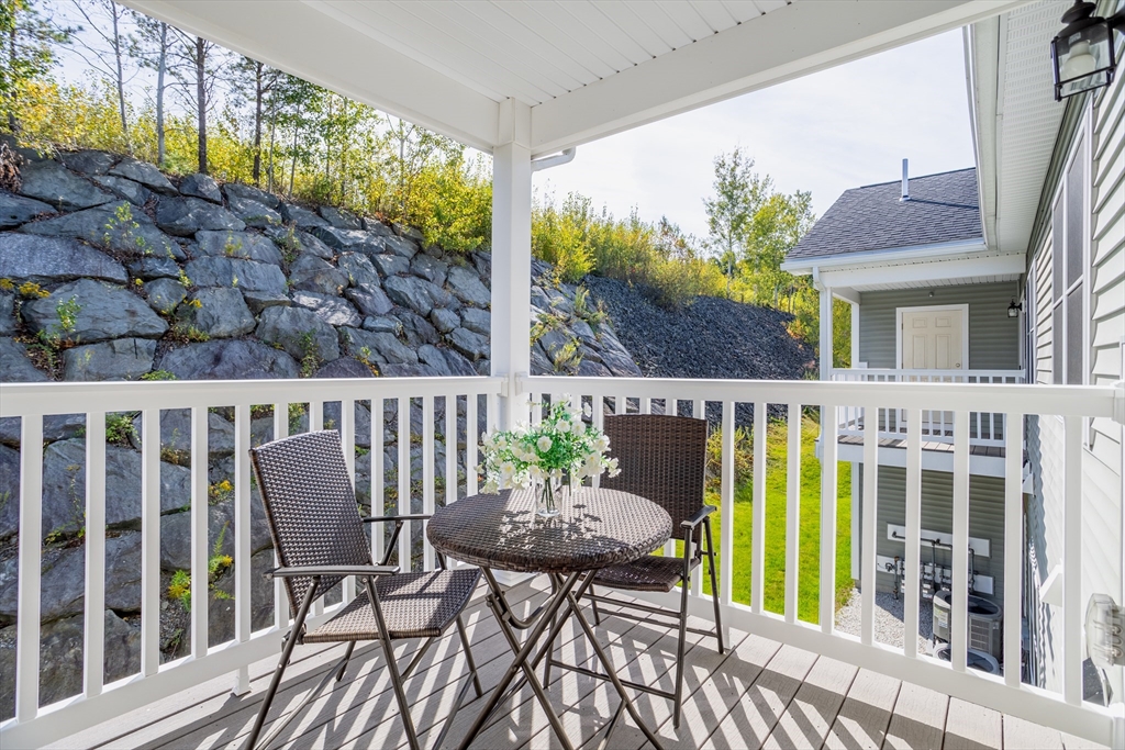 1221 Hazelwood Way, Unit 1221 Clinton, MA 01510 - Photo 16 of 42 a view of a chairs and table in patio