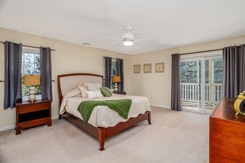 1221 Hazelwood Way, Unit 1221 Clinton, MA 01510 - Photo 23 of 42 a bedroom with a bed and a window