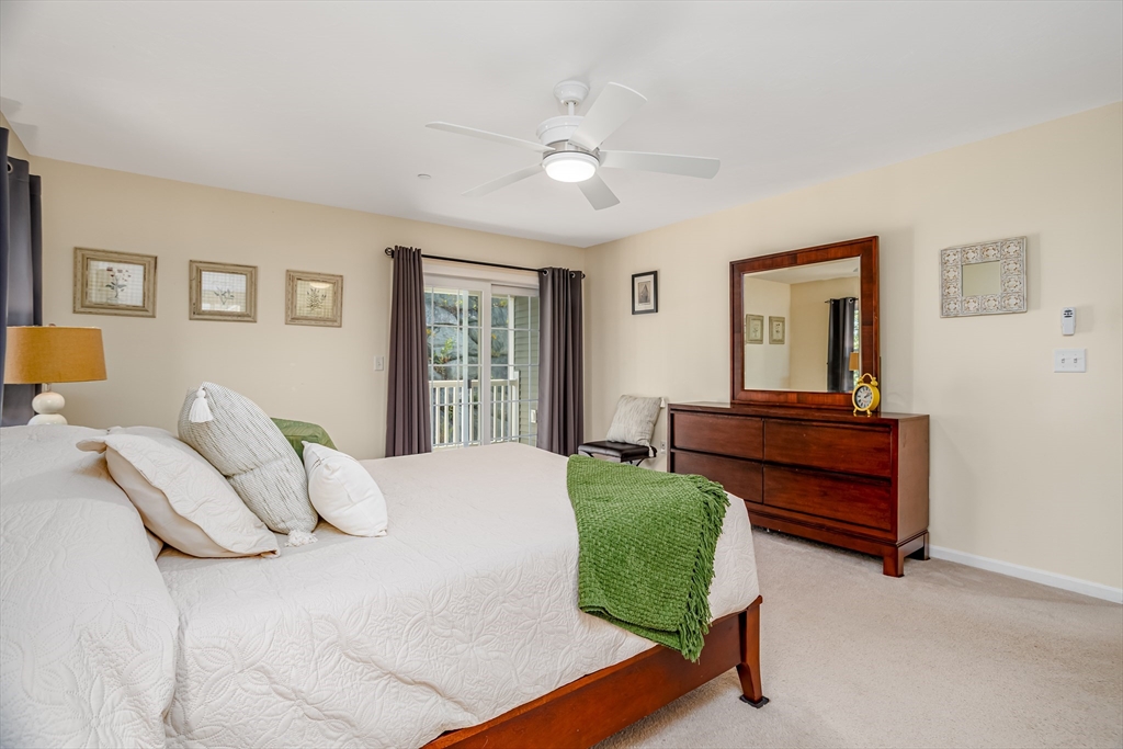 1221 Hazelwood Way, Unit 1221 Clinton, MA 01510 - Photo 24 of 42 a bedroom with a bed and window