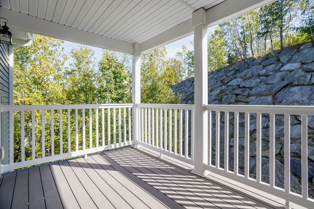 1221 Hazelwood Way, Unit 1221 Clinton, MA 01510 - Photo 28 of 42 a view of a wooden balcony