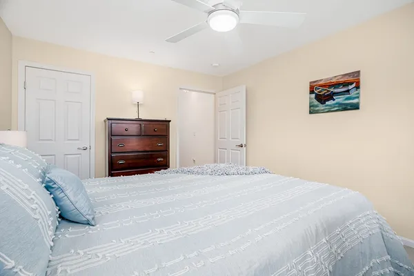 a bedroom with a bed and a closet