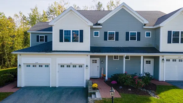 an aerial view of house with yard