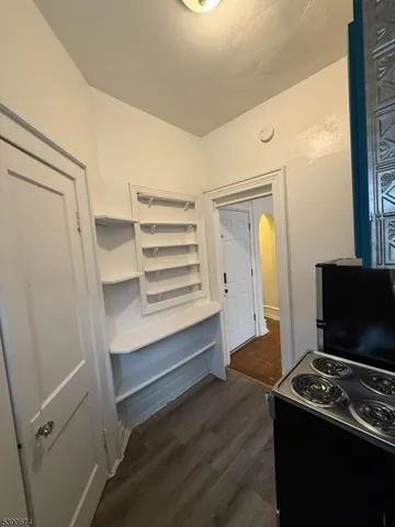 a kitchen with a sink cabinets and a stove top oven