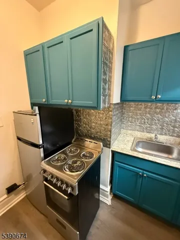 a living room with furniture rug and wooden floor
