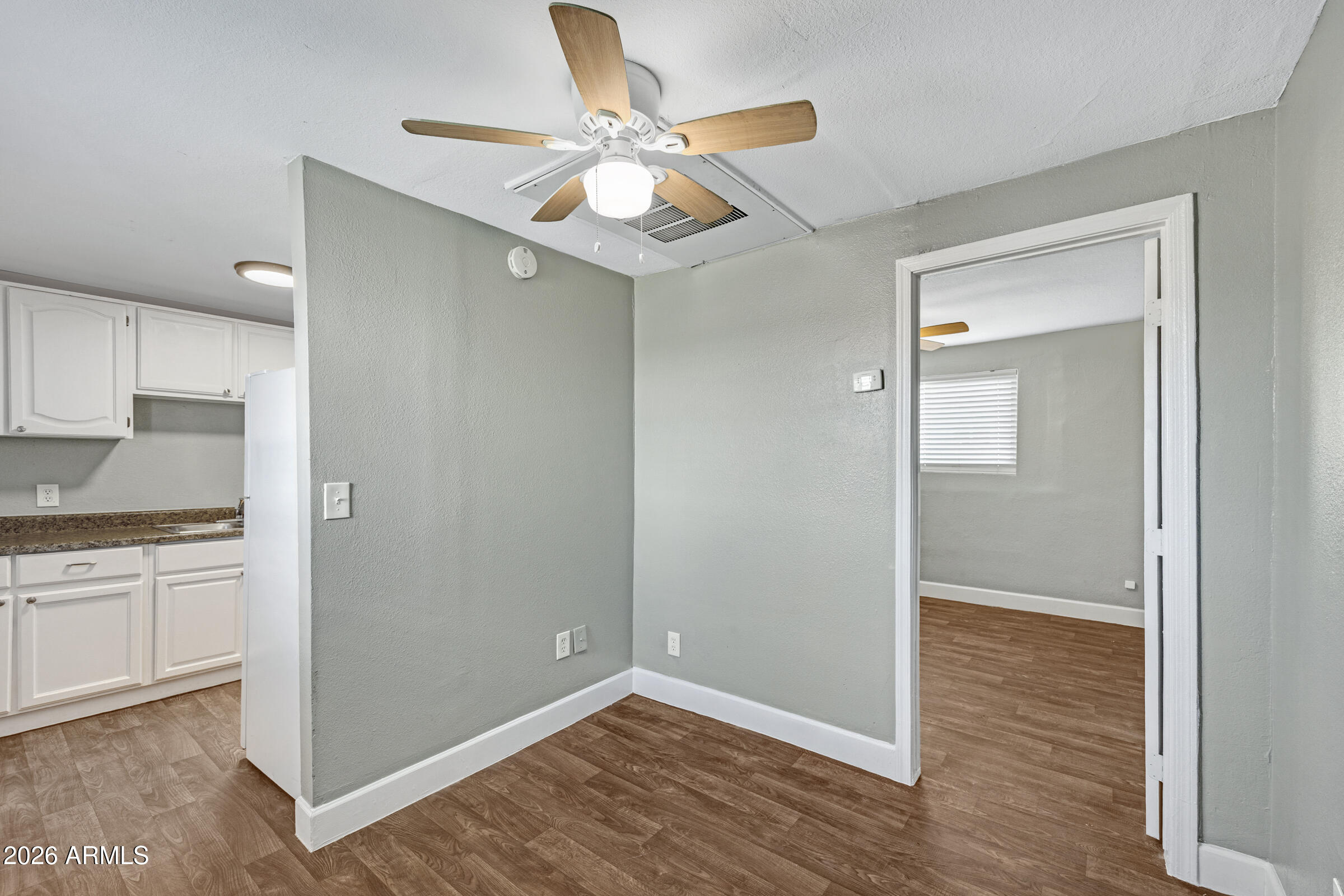 2238 East Taylor Street Phoenix, AZ 85006 - Photo 12 of 57 a view of cabinets and wooden floor