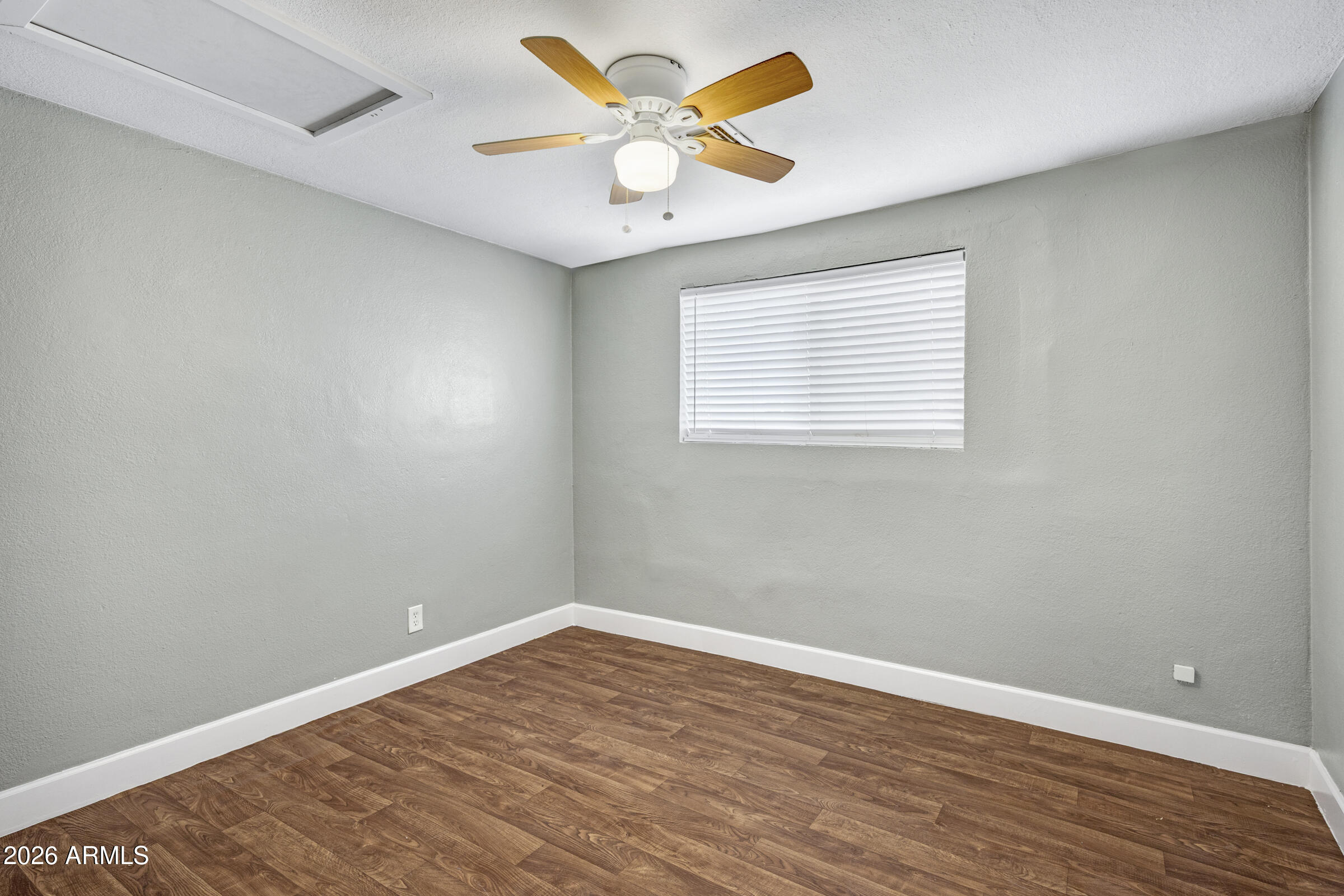 2238 East Taylor Street Phoenix, AZ 85006 - Photo 13 of 57 wooden floor in an empty room with a window