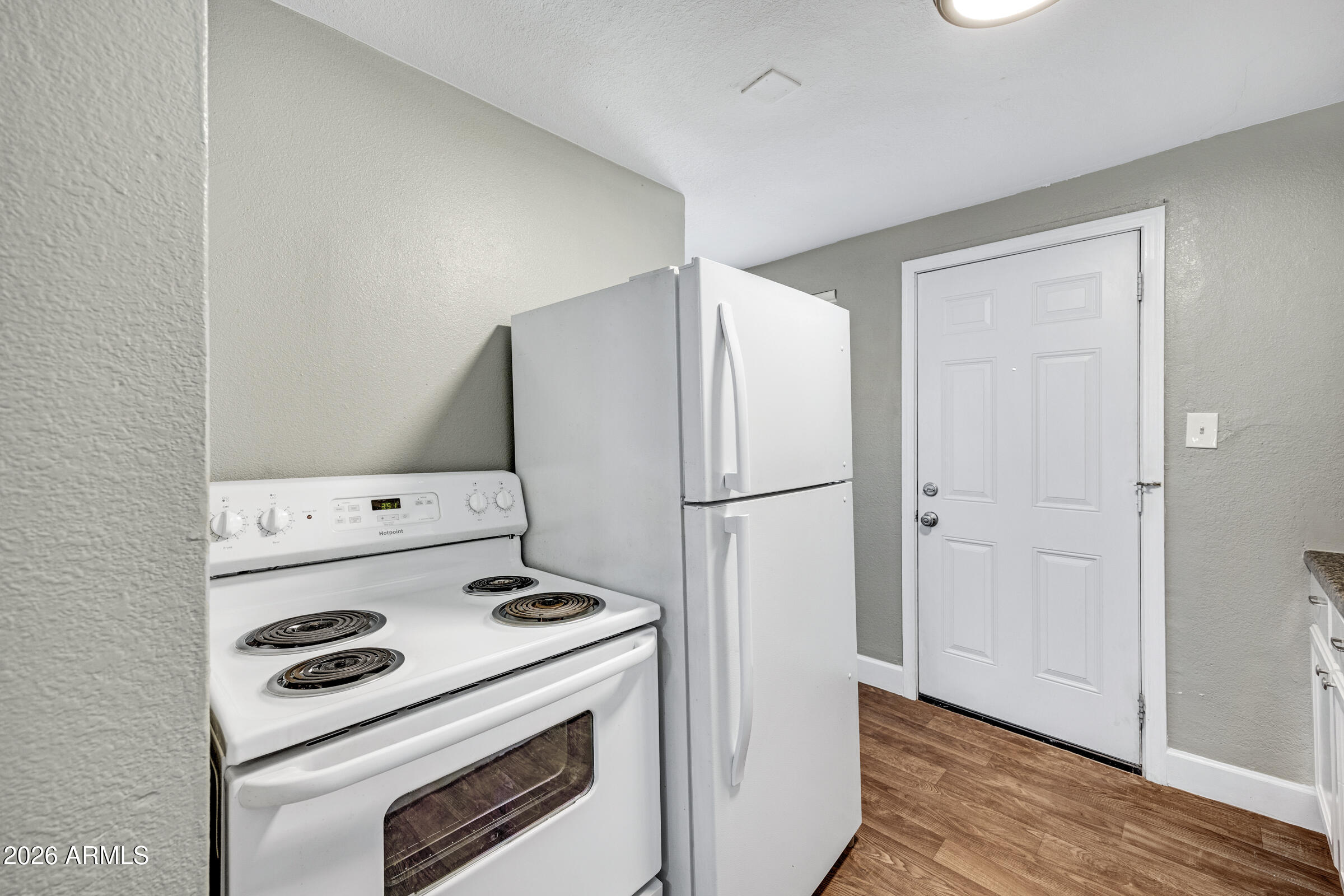 2238 East Taylor Street Phoenix, AZ 85006 - Photo 17 of 57 a kitchen with a stove and a refrigerator