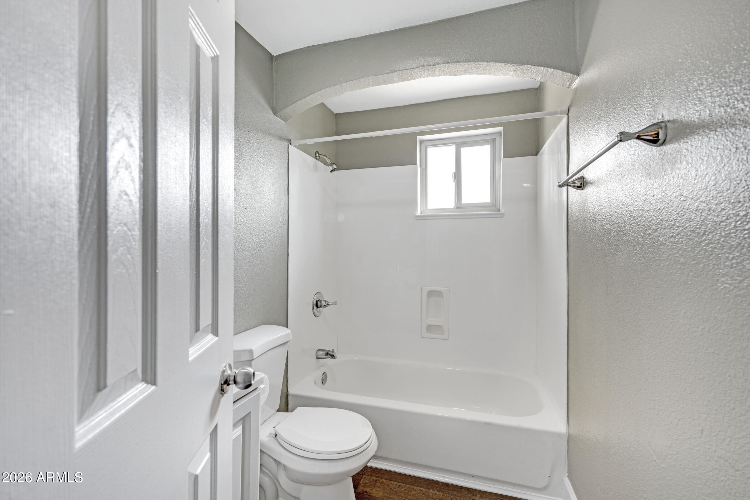 2238 East Taylor Street Phoenix, AZ 85006 - Photo 19 of 57 a bathroom with a toilet and a bathtub