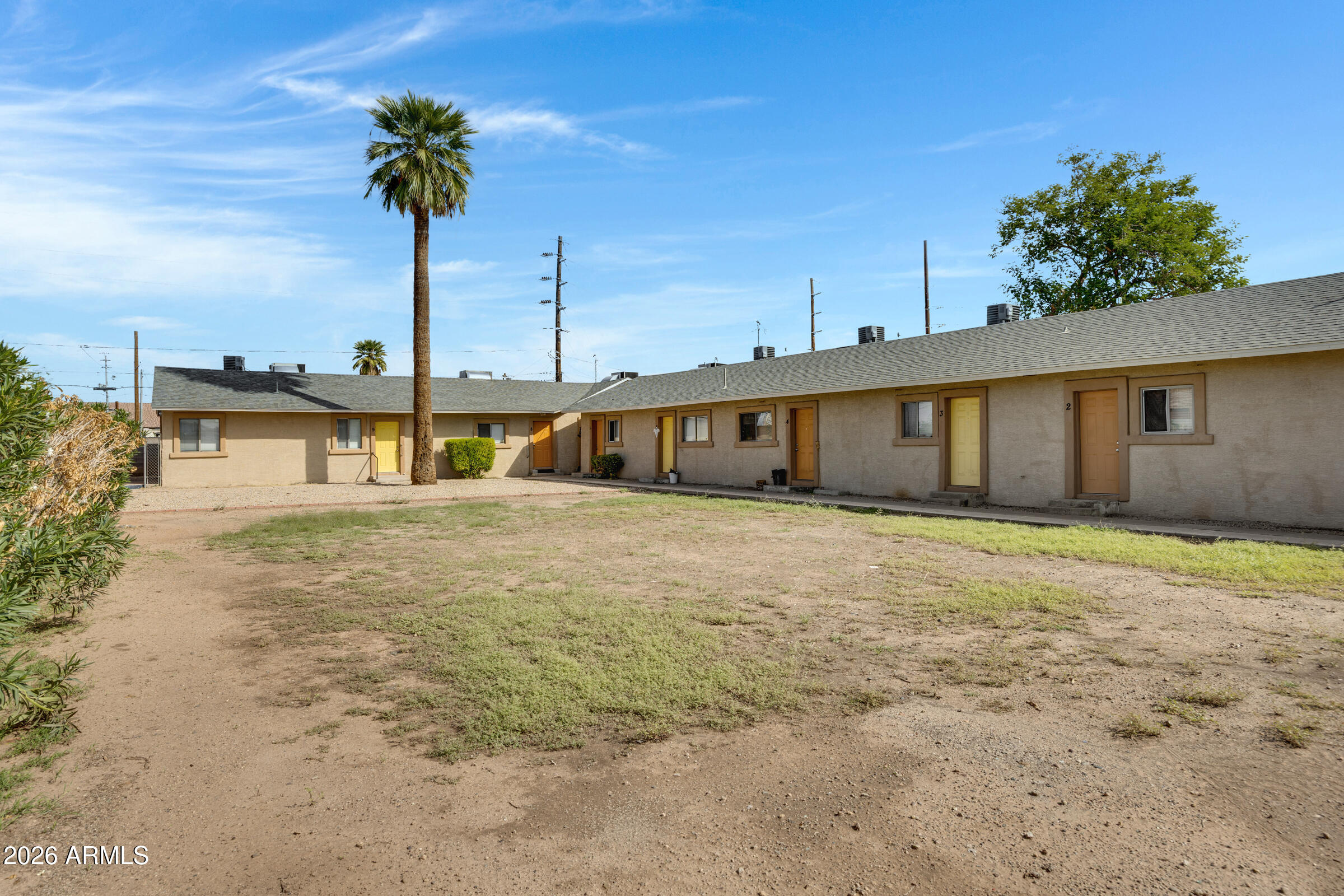 2238 East Taylor Street Phoenix, AZ 85006 - Photo 4 of 57 a front view of a house with a garden and yard