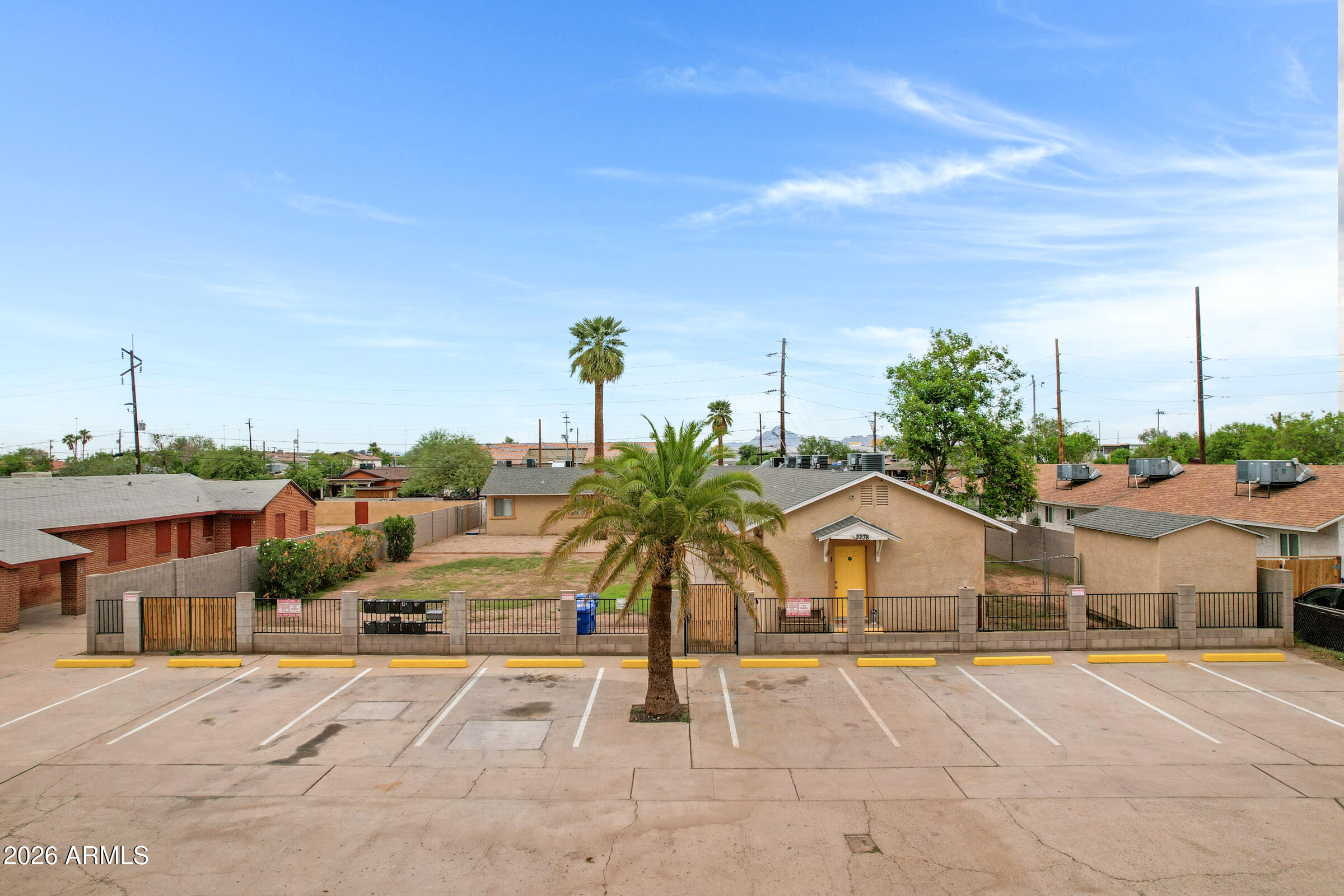 2238 East Taylor Street Phoenix, AZ 85006 - Photo 46 of 57 a front view of a house with a yard and potted plants