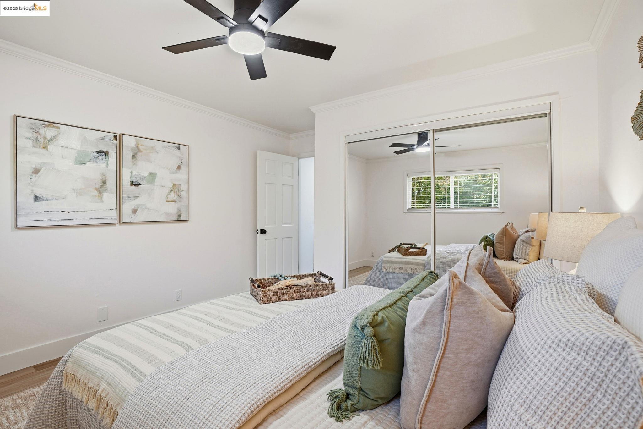 168 High Street Pacheco, CA 94553 - Photo 20 of 33 a bedroom with a bed and a chandelier