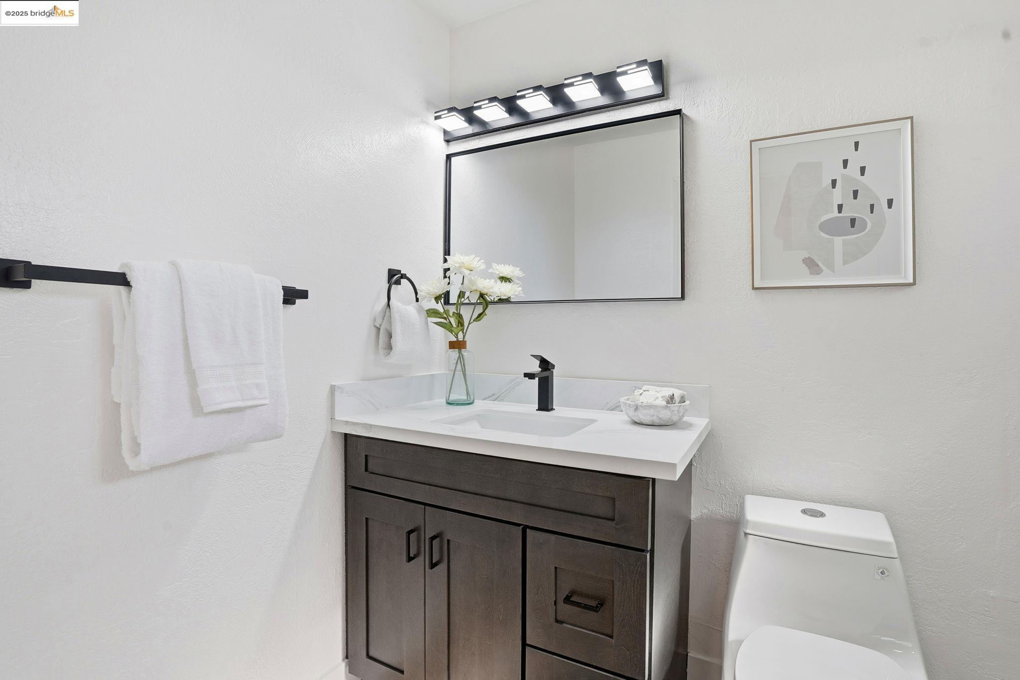 168 High Street Pacheco, CA 94553 - Photo 29 of 33 a bathroom with a sink vanity and a mirror