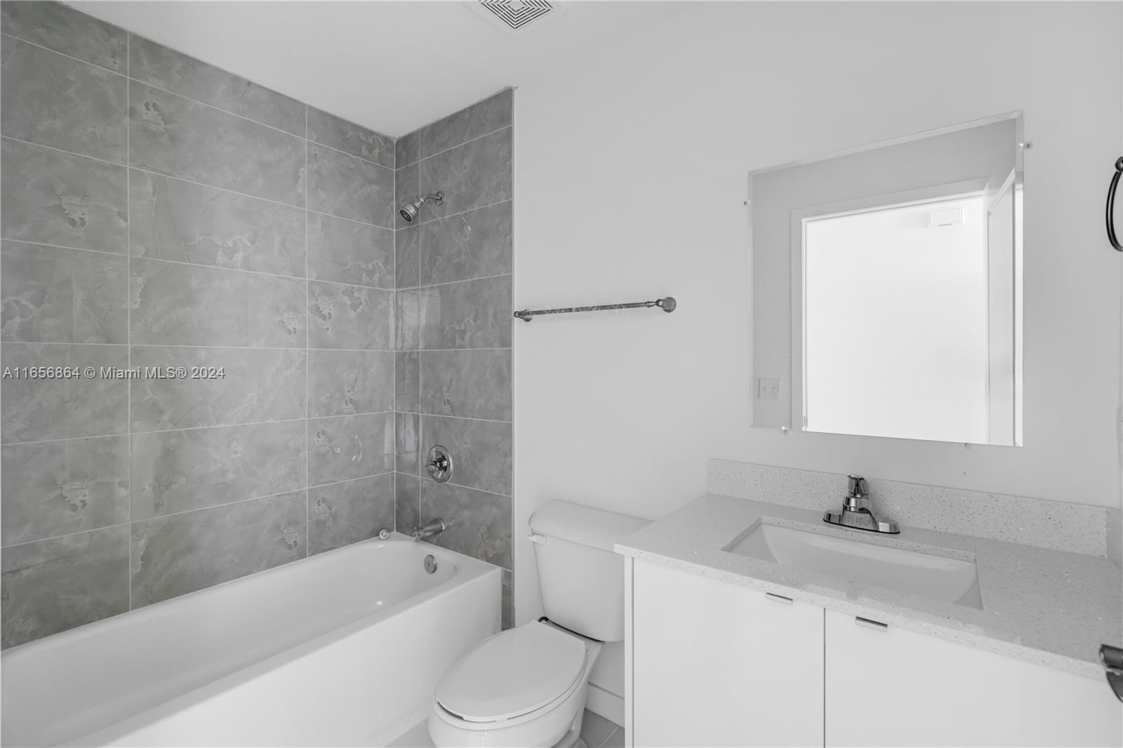 152 Northwest 18th Street Homestead, FL 33030 - Photo 22 of 28 a bathroom with a bathtub shower sink vanity and toilet