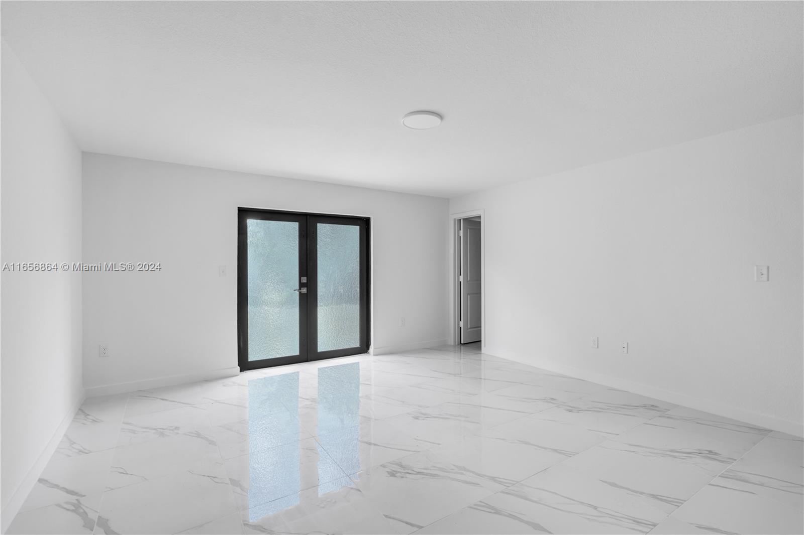 152 Northwest 18th Street Homestead, FL 33030 - Photo 23 of 28 a view of an empty room with a window