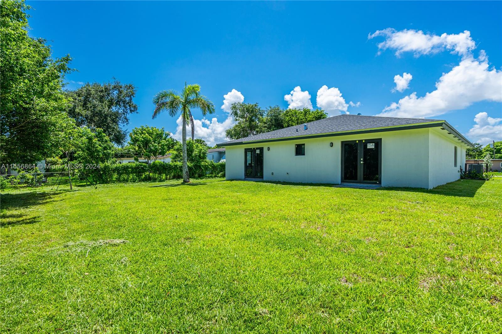 152 Northwest 18th Street Homestead, FL 33030 - Photo 26 of 28 a front view of a house with a yard