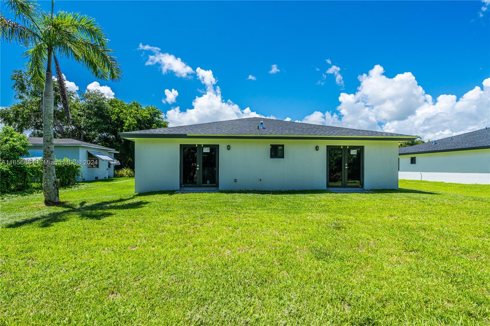 152 Northwest 18th Street Homestead, FL 33030 - Photo 27 of 28 a view of a house with a yard and a tree