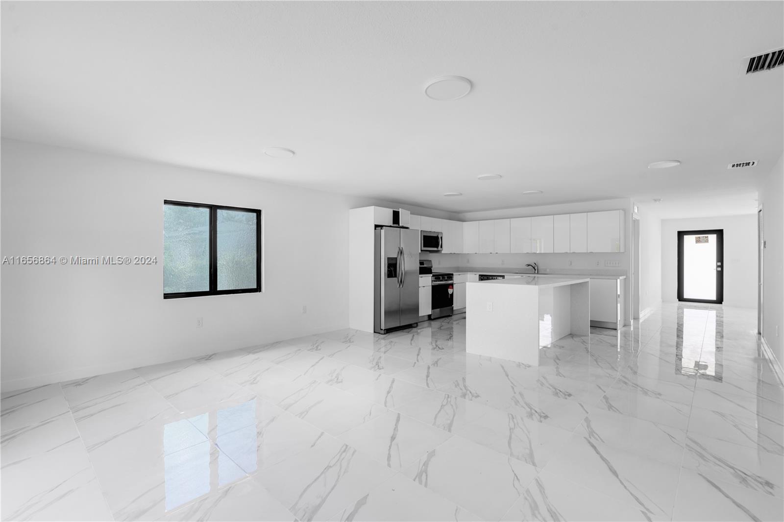 152 Northwest 18th Street Homestead, FL 33030 - Photo 7 of 28 a view of a big room with closet and windows