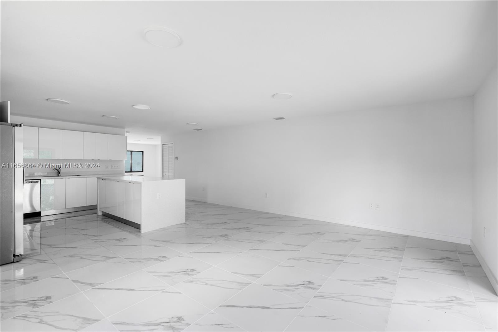 152 Northwest 18th Street Homestead, FL 33030 - Photo 8 of 28 a view of a kitchen with white cabinets