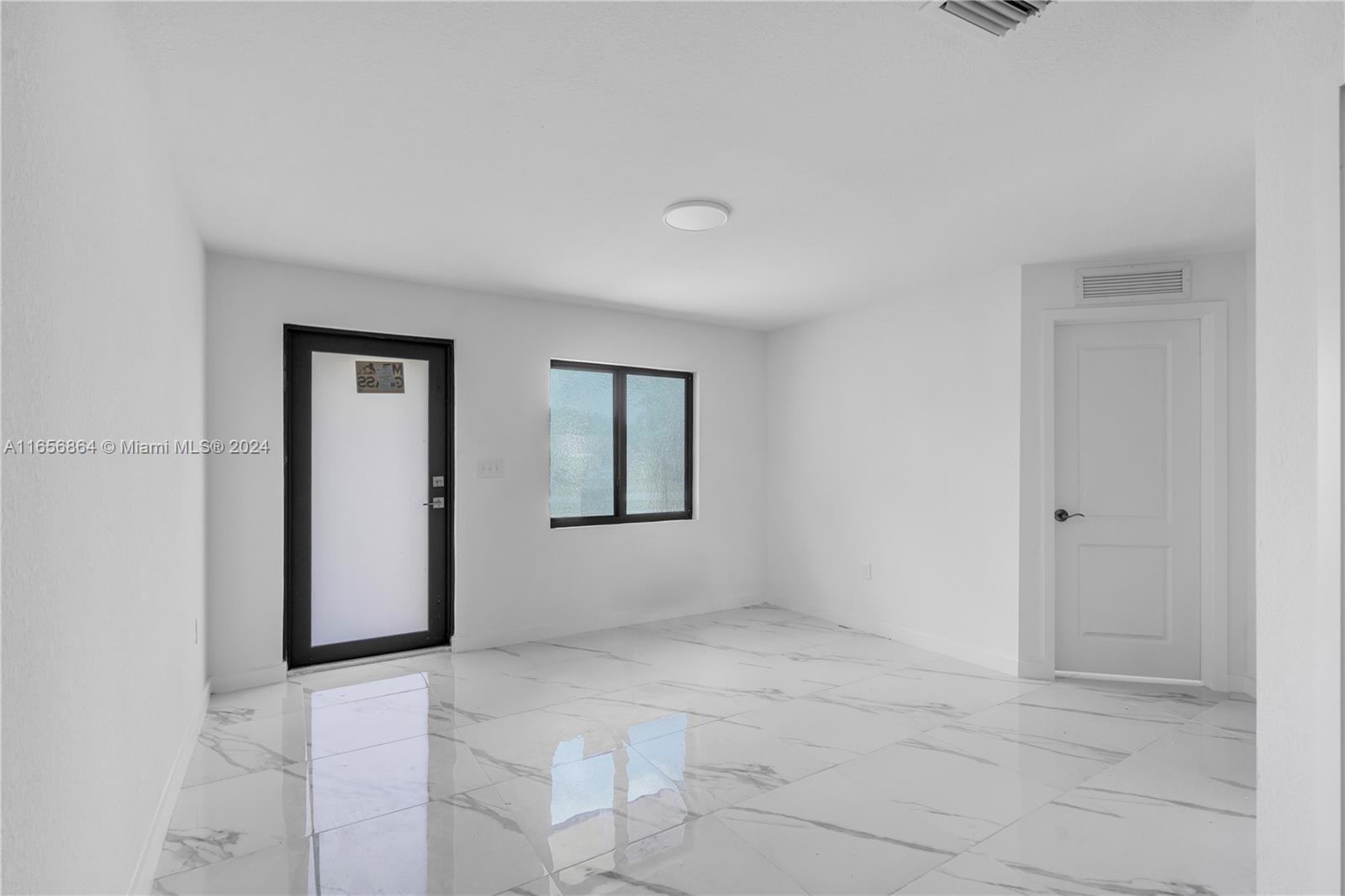 152 Northwest 18th Street Homestead, FL 33030 - Photo 10 of 28 a view of an empty room