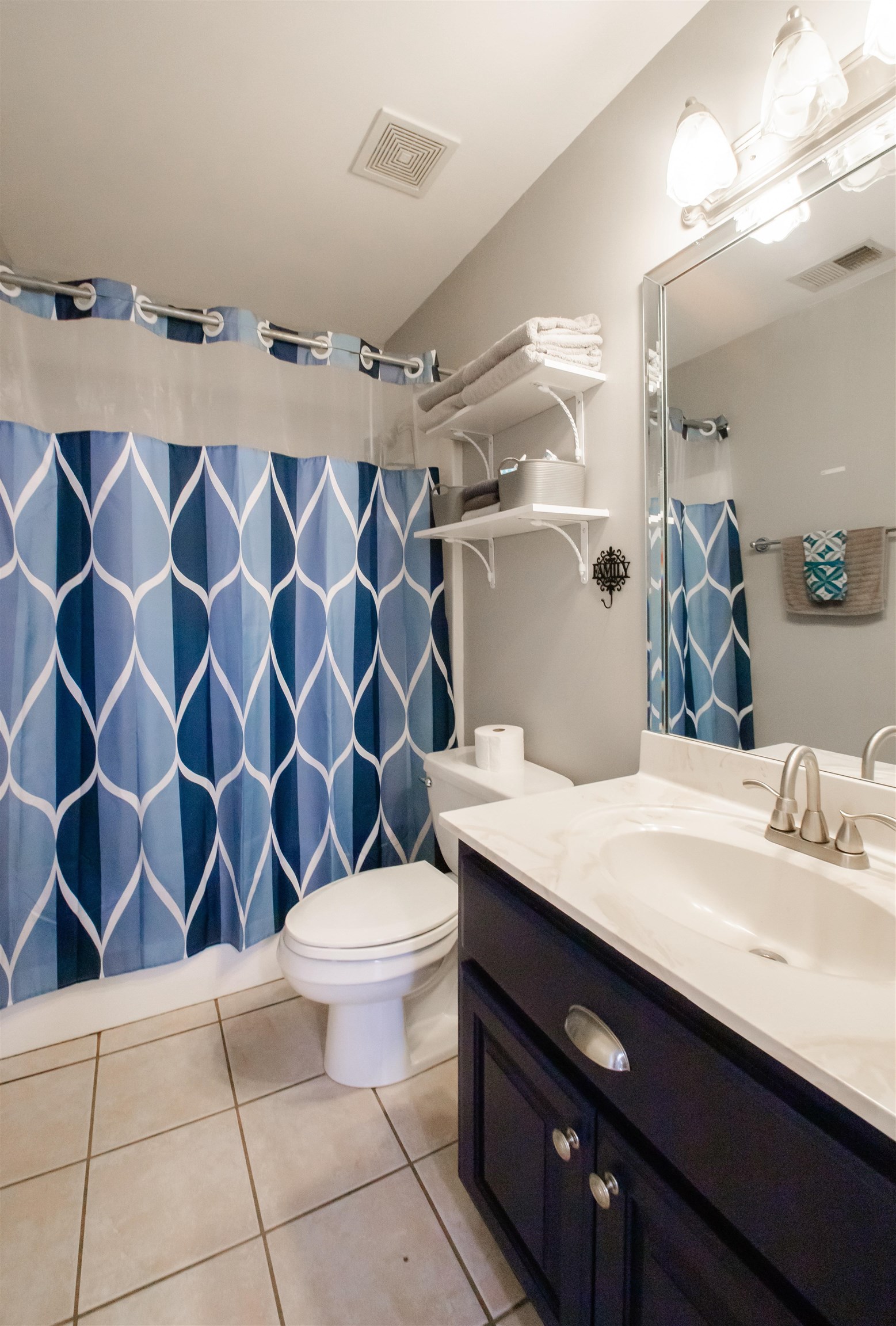 74 Huffman Road Brighton, TN 38011 - Photo 12 of 28 Bathroom featuring vanity, toilet, and tile patterned flooring