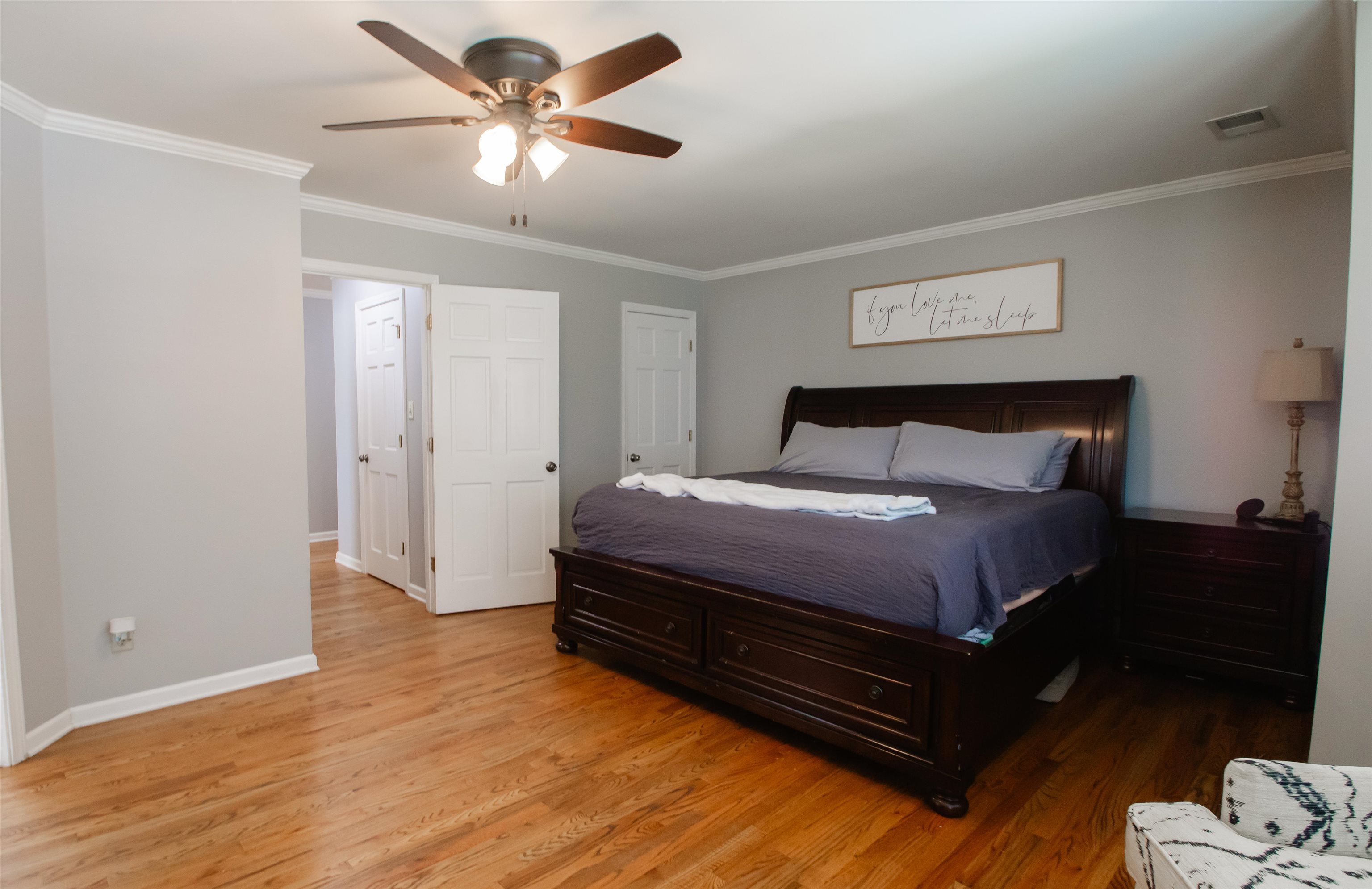74 Huffman Road Brighton, TN 38011 - Photo 14 of 28 Bedroom featuring ornamental molding, ceiling fan, and light wood-type flooring