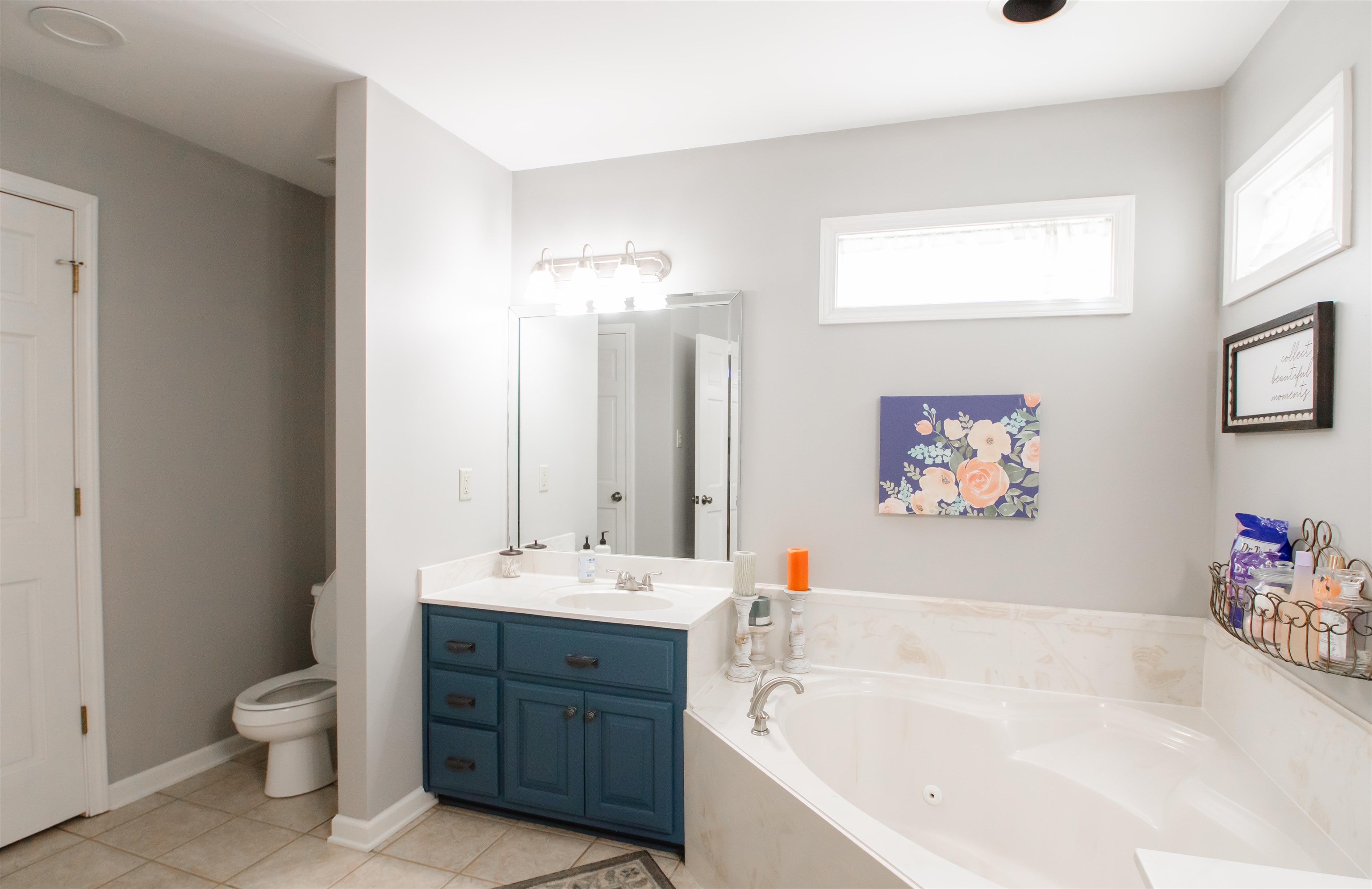74 Huffman Road Brighton, TN 38011 - Photo 15 of 28 Bathroom with tile patterned floors, vanity, a bath, and toilet