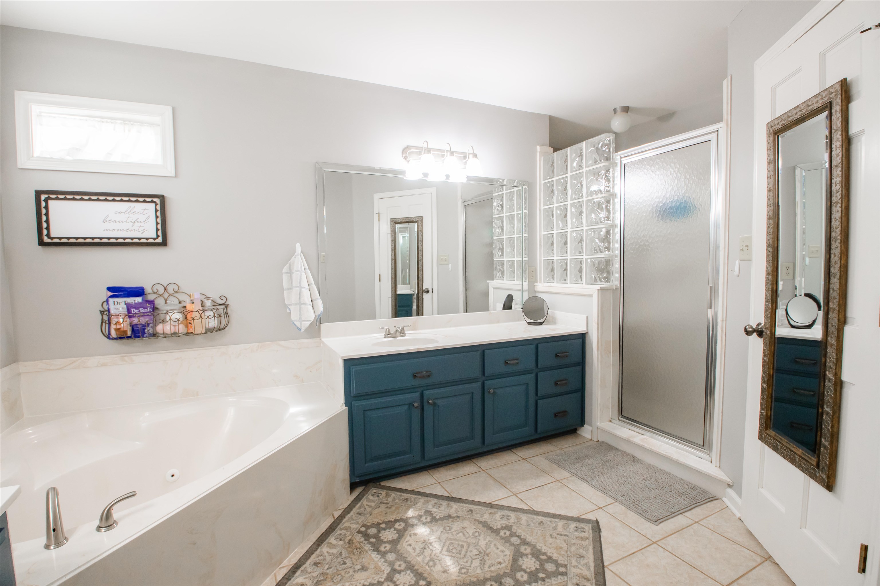 74 Huffman Road Brighton, TN 38011 - Photo 16 of 28 Bathroom with vanity, tile patterned flooring, and separate shower and tub