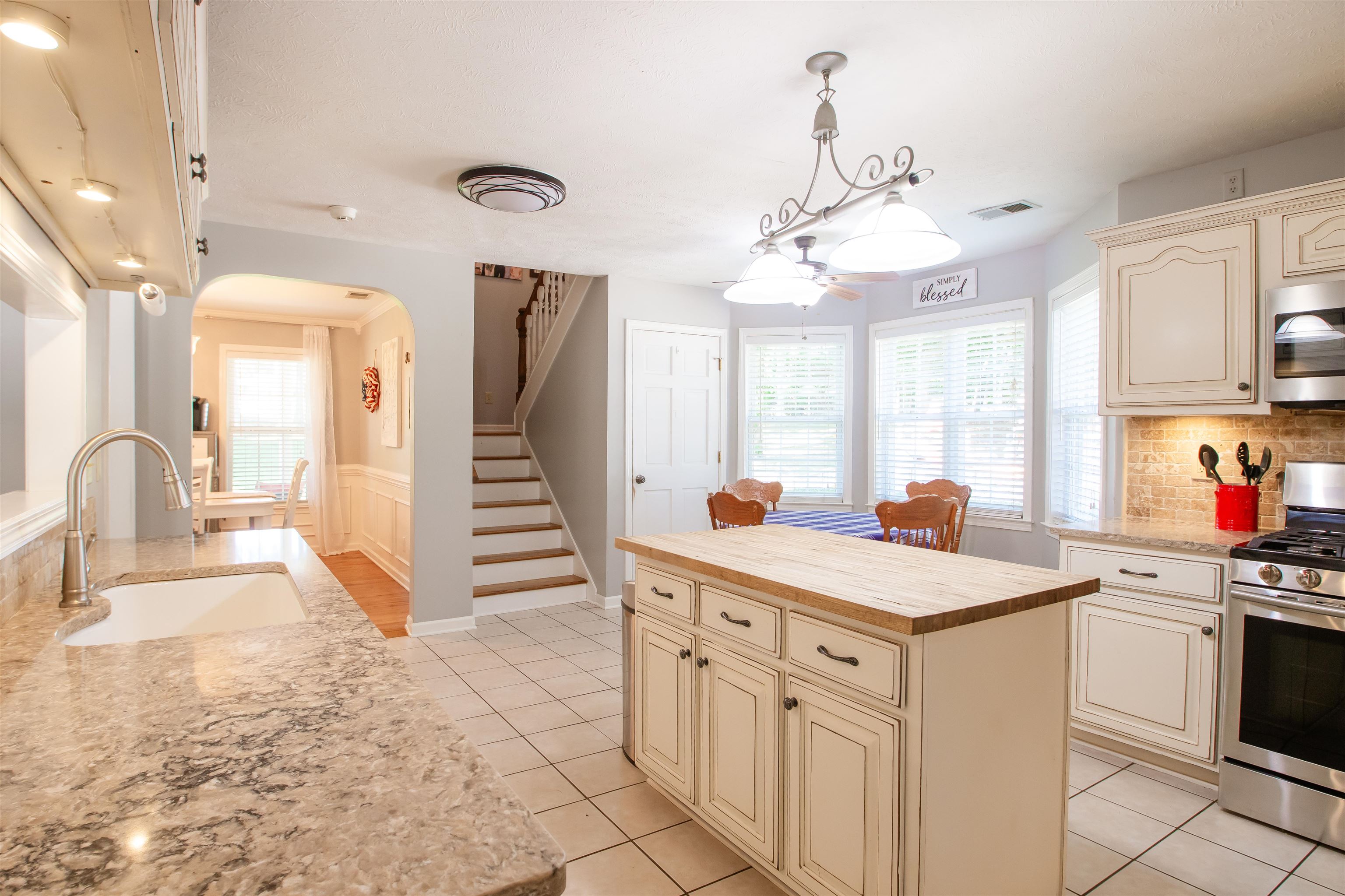 74 Huffman Road Brighton, TN 38011 - Photo 18 of 28 Kitchen with stainless steel appliances, sink, a wealth of natural light, decorative light fixtures, and a kitchen island