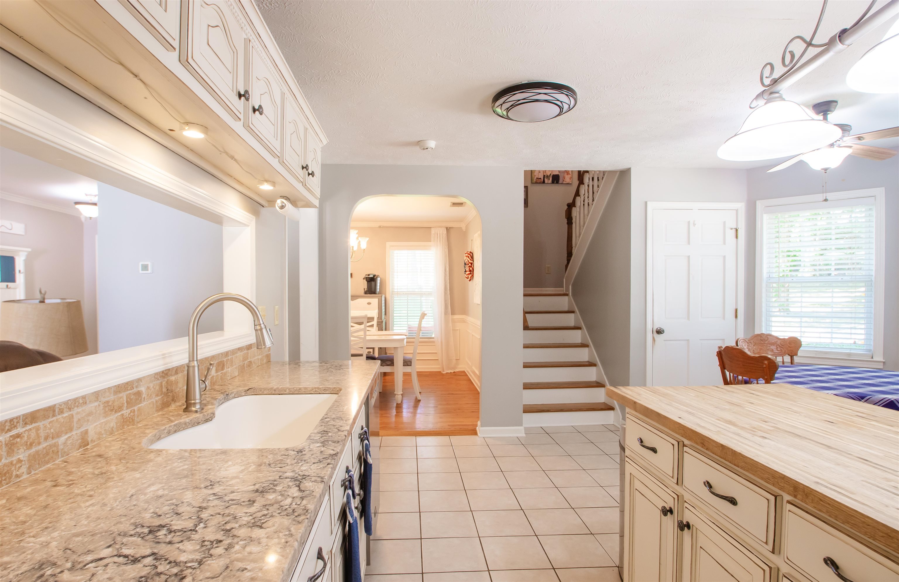 74 Huffman Road Brighton, TN 38011 - Photo 19 of 28 Kitchen with a healthy amount of sunlight, light hardwood / wood-style floors, sink, and ceiling fan