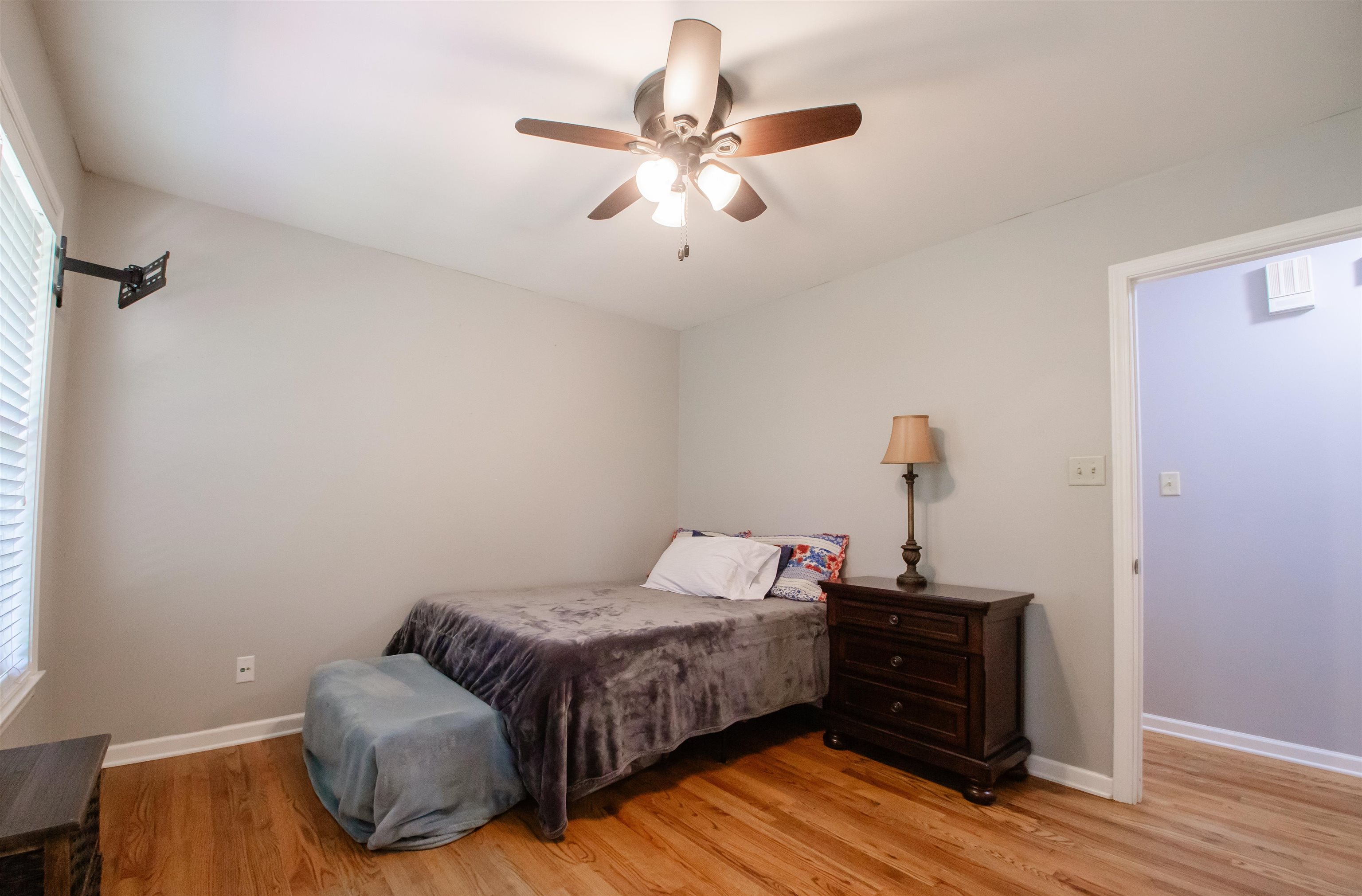 74 Huffman Road Brighton, TN 38011 - Photo 10 of 28 Bedroom featuring multiple windows, hardwood / wood-style floors, and ceiling fan