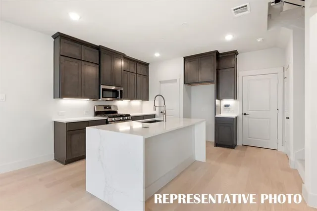 a view of a kitchen with a sink