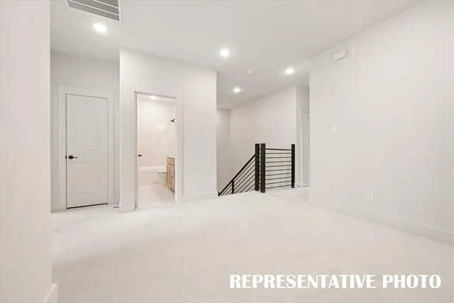 a kitchen with stainless steel appliances a refrigerator sink and microwave