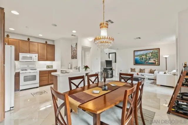 a kitchen with a sink appliances and cabinets
