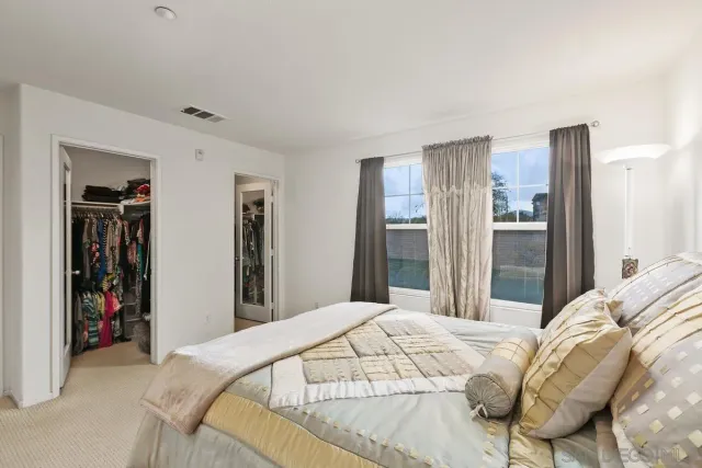 a bathroom with a double vanity sink a mirror and a shower