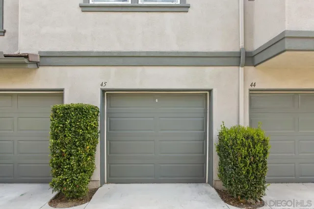 a view of room with a door and a potted plant
