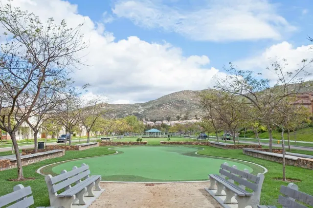 a view of a swimming pool and a yard