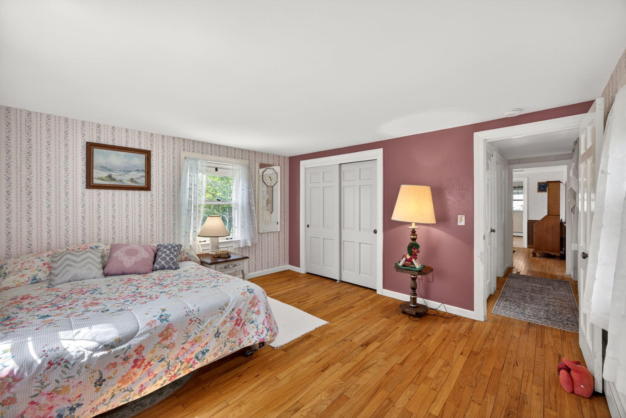 23 Nickerson Road Orleans, MA 02653 - Photo 12 of 54 a bedroom with a bed and wooden floor