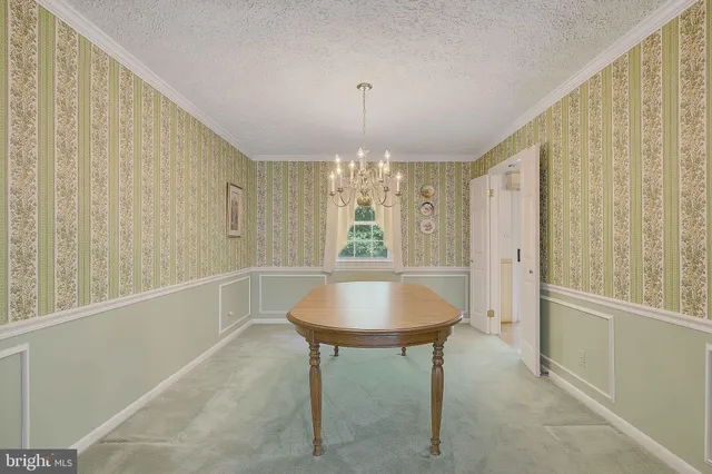 a kitchen with stainless steel appliances granite countertop a sink a stove and a microwave oven