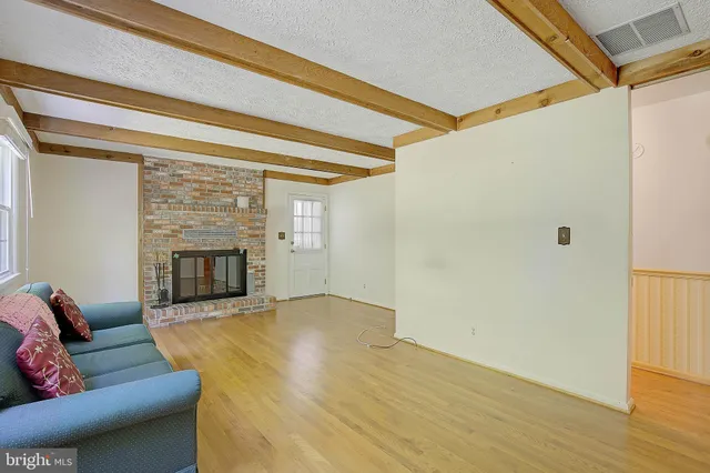 a bedroom with a bed and a view of bathroom